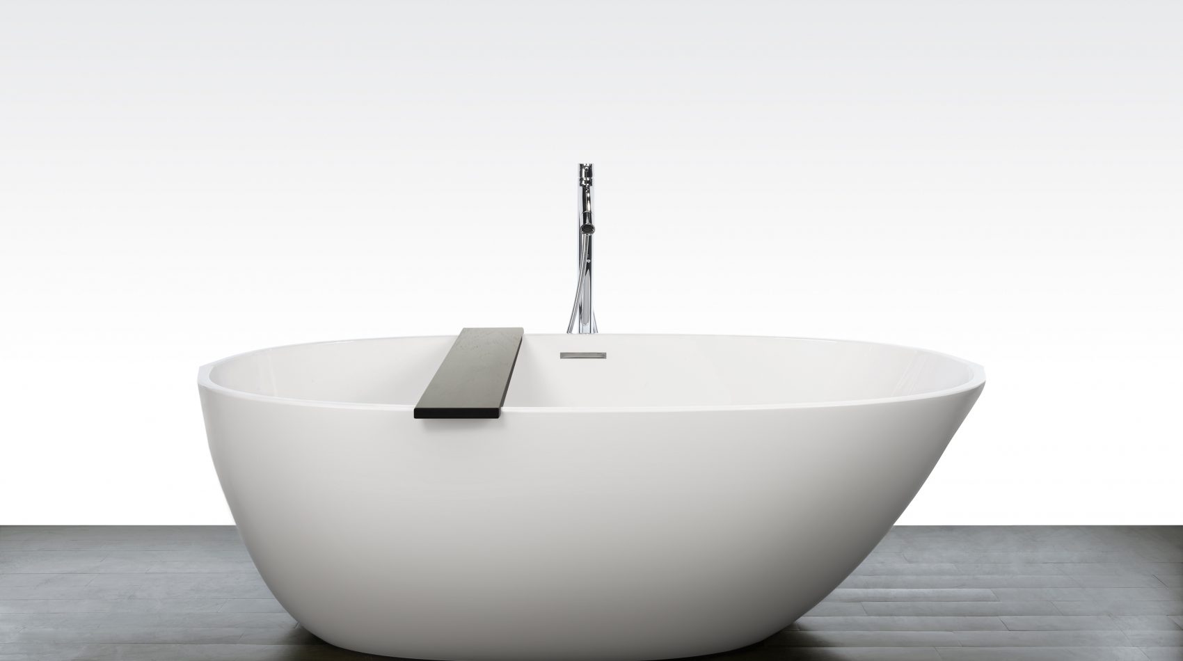 Luxury freestanding white bathtub with wooden shelf