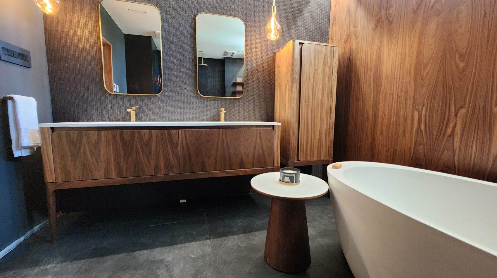 Luxury Bathroom Vanitiy in Walnut finish, freestanding bathtub and custom linen cabinets